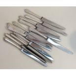 A set of twelve silver handled tea knives of taper