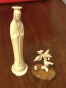 A carved ivory figure of a tree with seated birds