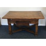 A large Continental occasional table on stretcher