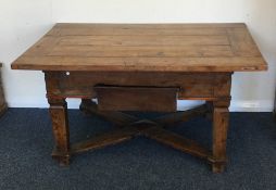 A large Continental occasional table on stretcher