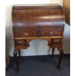 A 20th Century walnut cylinder top bureau. Est. £3