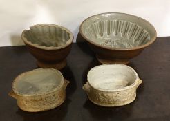 Two pottery jelly moulds etc. Est. £15 - £20.