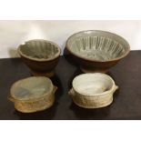 Two pottery jelly moulds etc. Est. £15 - £20.