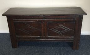 A Georgian oak plank top coffer with hinged lid. E