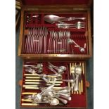 An oak cased silver plated rat tail cutlery set. E