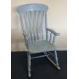 An old painted slat back rocking chair. Est. £30 -