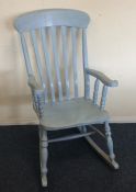 An old painted slat back rocking chair. Est. £30 -