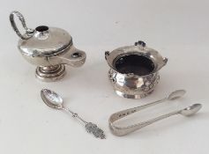 An old silver Aladdin's lamp together with a salt