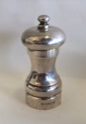 A silver pepper grinder. London. By DF. Approx. 1