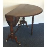A Victorian walnut Sutherland table with fluted de
