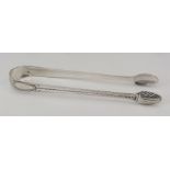 A pair of bright cut silver sugar tongs with scrol