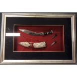 A framed and glazed silver mounted knife in fitted