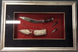 A framed and glazed silver mounted knife in fitted