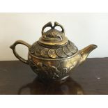 An unusual Chinese brass teapot with lift-off cove