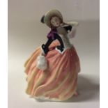 A Royal Doulton figure entitled, 'Autumn Breezes'.