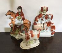 A group of three Staffordshire figures. Est. £25 -