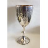 An attractive silver goblet decorated with scrolls