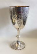 An attractive silver goblet decorated with scrolls