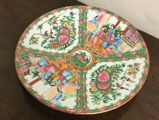 A circular Canton plate decorated in bright colour