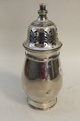 An Edwardian silver baluster shaped caster. Birmin