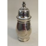 An Edwardian silver baluster shaped caster. Birmin