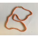 A small string of tapering coral beads. Approx. 8