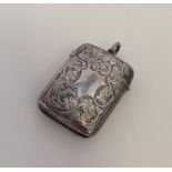 An attractive silver scroll decorated vesta case w