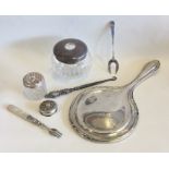 A bag containing silver hand mirror, dressing tabl