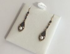A pair of sapphire and diamond drop earrings with