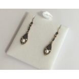 A pair of sapphire and diamond drop earrings with