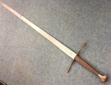 A Medieval style sword with wire work handle. Est.