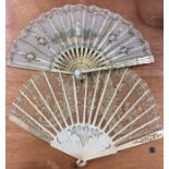 An attractive lacework fan together with one other