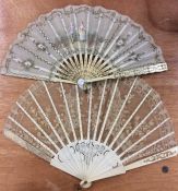 An attractive lacework fan together with one other