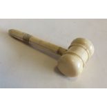 An Antique ivory gavel with turned handle. Est. £5