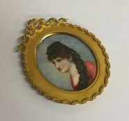 An attractive Antique oval miniature of a lady. Es
