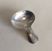 EXETER: A bright cut silver caddy spoon with oval