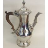 A tall George III silver coffee pot of baluster fo