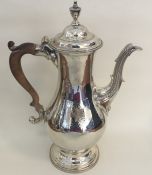 A tall George III silver coffee pot of baluster fo