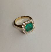 An attractive square emerald and diamond cluster r