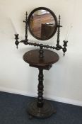 An unusual mahogany shaving stand with candle scon
