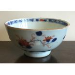 A Chinese circular bowl decorated with flowers. Ap