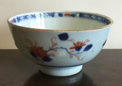 A Chinese circular bowl decorated with flowers. Ap