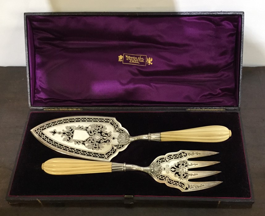 A good Victorian boxed pair of silver fish servers