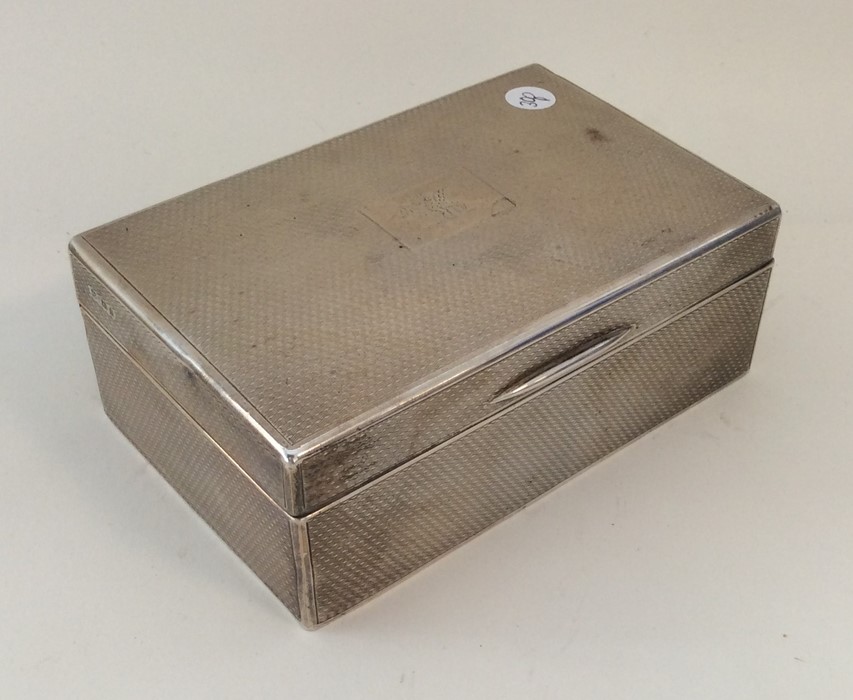 A good quality engine turned silver cigarette box.