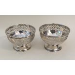 A pair of attractive silver bonbon dishes on sprea