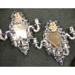 A pair of attractive flamboyant wall brackets with