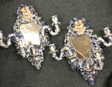 A pair of attractive flamboyant wall brackets with