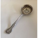 A Continental silver sifter spoon with squat bowl