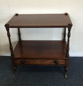 A mahogany single drawer stand with turned support