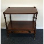 A mahogany single drawer stand with turned support